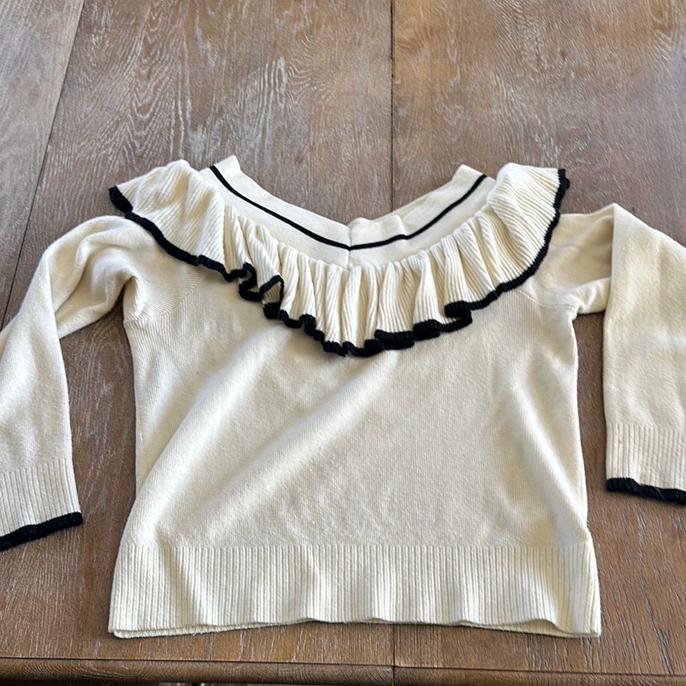 Chic Ruffled Sweater with Black Trim